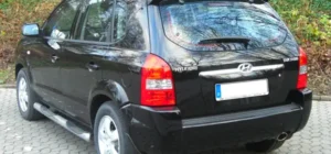 Descargar Manual de Propietario HYUNDAI Tucson OM 2005